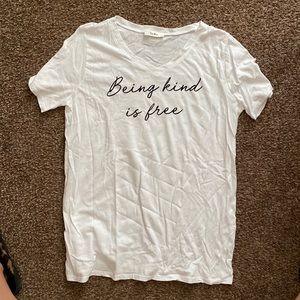 White “being kind is free” graphic tee